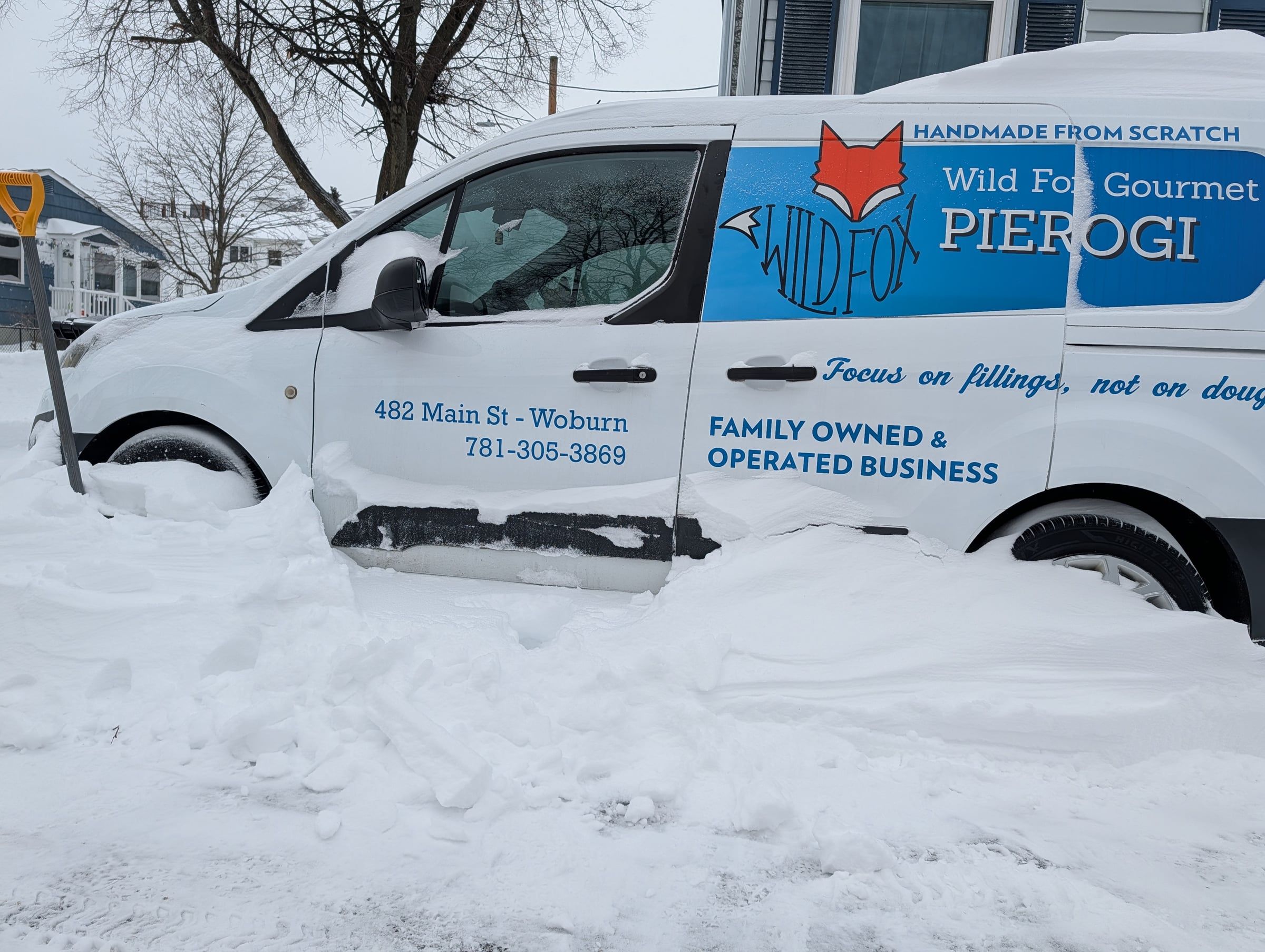The Wild Fox Pierogi van parked in deep snow